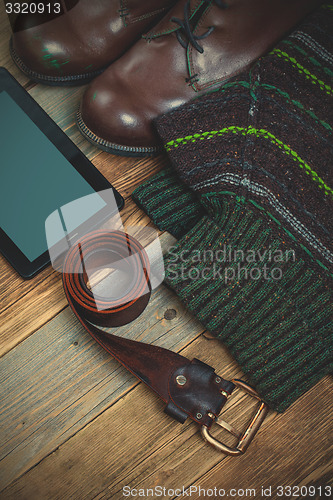 Image of vintage boots, leather belt, sweater and digitizer