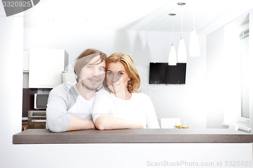 Image of Smiling Couple  In New Home