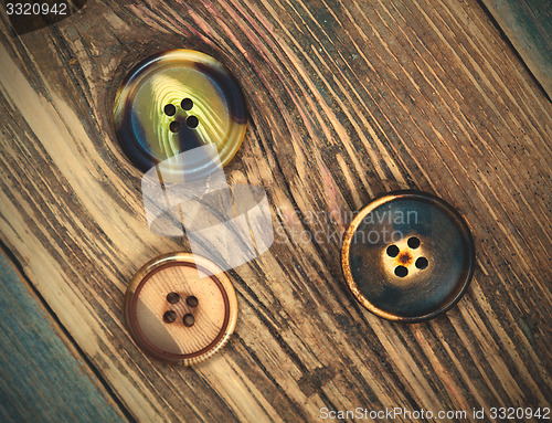 Image of three vintage buttons