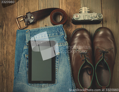 Image of traveler set with a digitizer, leather belt, rangefinder camera,
