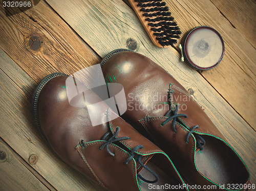 Image of vintage boots brush and shoe polish