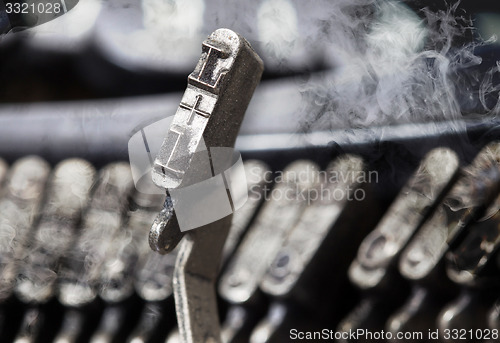Image of L hammer - old manual typewriter - mystery smoke