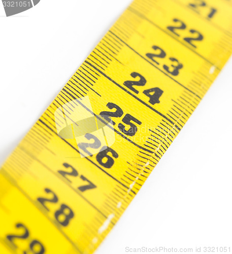 Image of Yellow measuring tape isolated - selective focus