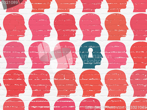 Image of Studying concept: head with keyhole icon on wall background