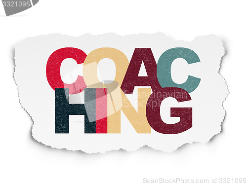 Image of Education concept: Coaching on Torn Paper background