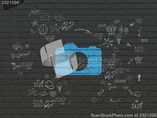 Image of Travel concept: Photo Camera on wall background