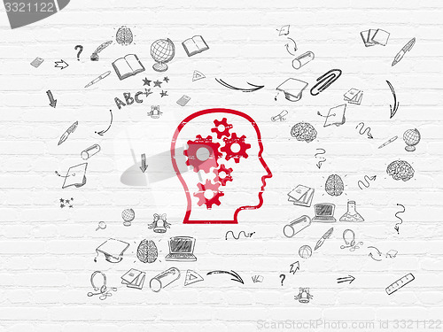 Image of Learning concept: Head With Gears on wall background