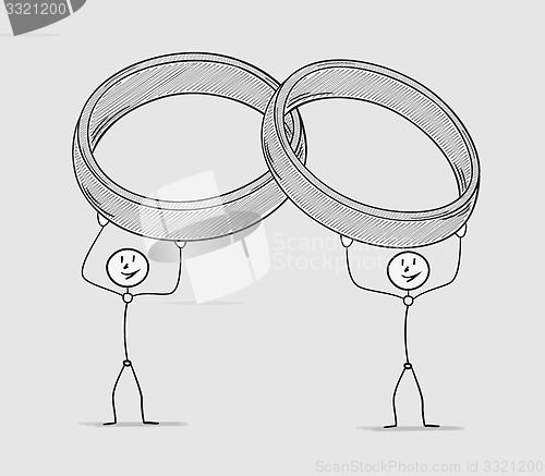 Image of two persons holding rings over their head