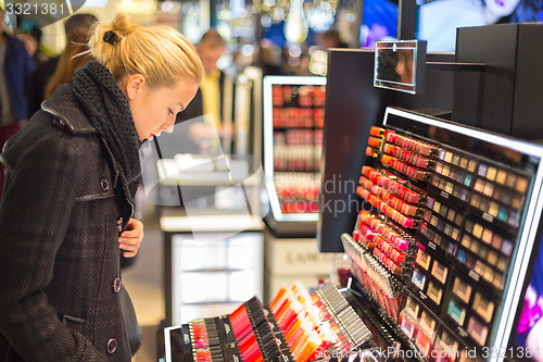 Image of Beautiful woman shopping in beauty store.