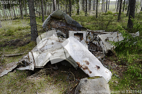 Image of remains of the car in forest