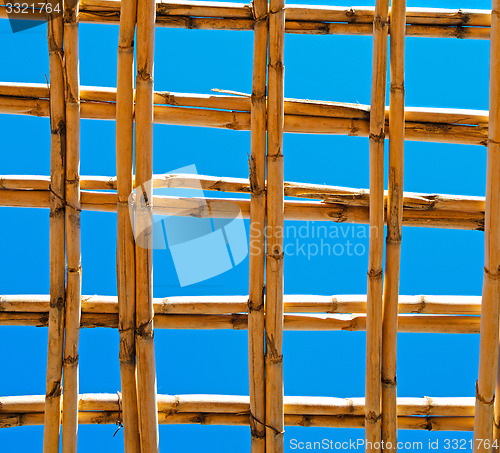 Image of morocco abstract bamboo roof in the  africa  sky