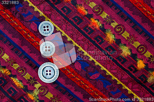 Image of vintage tape with embroidered ornaments and old buttons