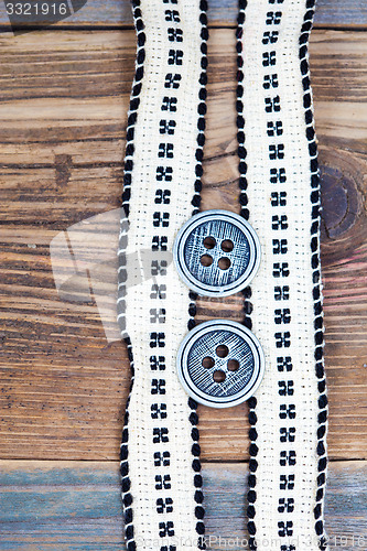 Image of Vintage tape with embroidered pattern and ancient classical butt