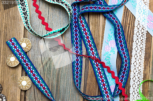 Image of lace, lribbons, tape and buttons