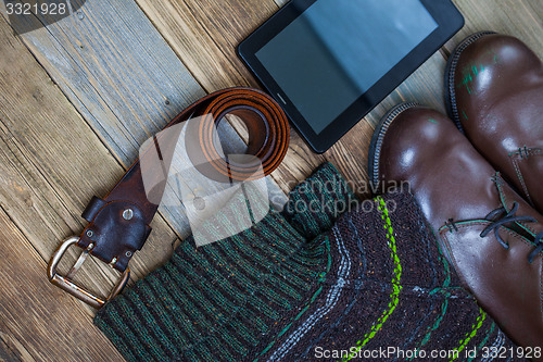 Image of vintage belt, leather boots, sweater and digitizer 
