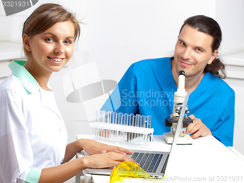 Image of Two young happy medical people
