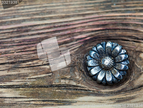 Image of vintage metallic button