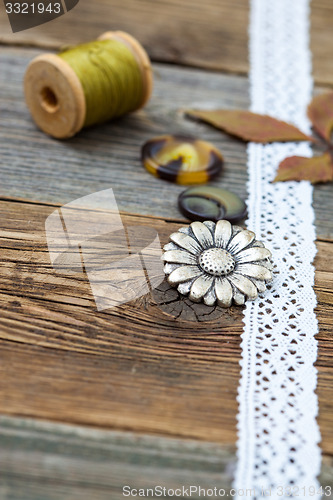 Image of vintage buttons with lace tape