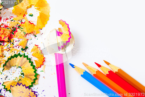 Image of set of colored pencils, sharpener and shavings