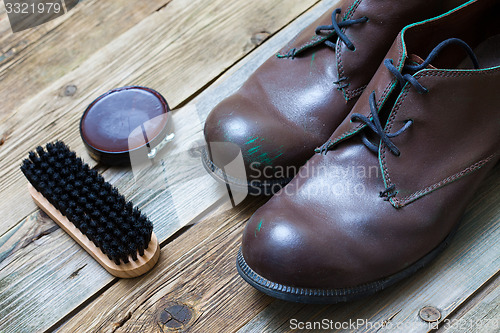 Image of boots brush and shoe polish