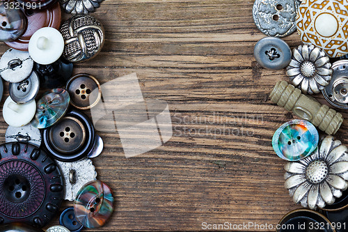 Image of set of vintage buttons on aged boards