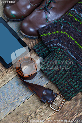 Image of vintage boots, leather belt, sweater and digitizer