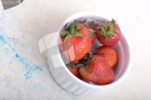 Image of Close up strawberry on old watercolor plate