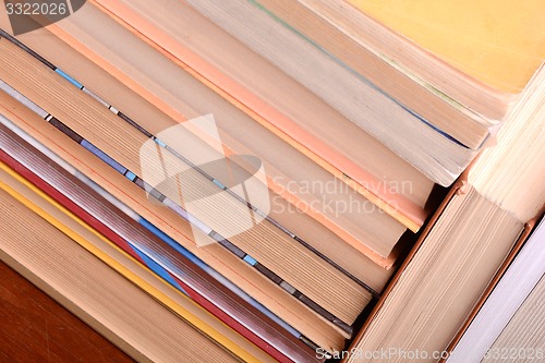 Image of Old books leaning against each other for sale