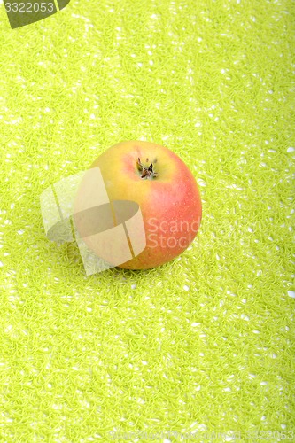 Image of fresh apple on green background