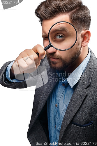 Image of Man with magnifying glass on white background