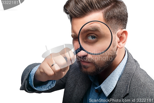 Image of Man with magnifying glass on white background
