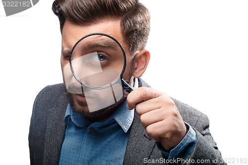 Image of Man with magnifying glass on white background