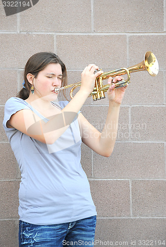 Image of Female trumpet player.