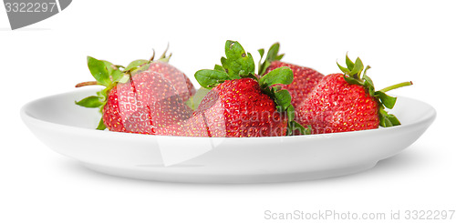 Image of Several pieces of strawberry on white plate