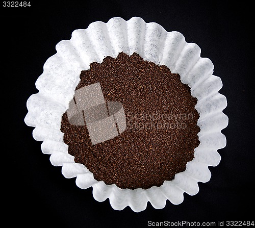 Image of coffee in filter on black