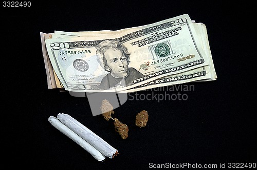 Image of money with pot on black