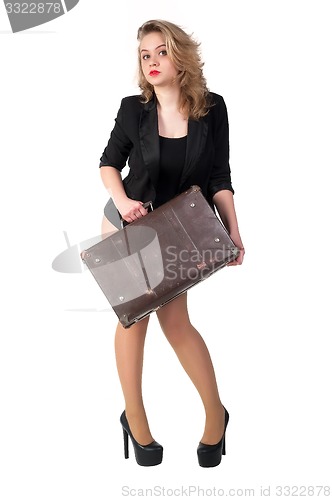 Image of Pretty sexy blonde woman with old suitcase