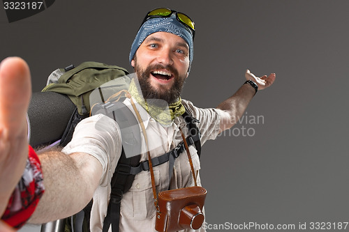 Image of Portrait of a smiling male fully equipped tourist 