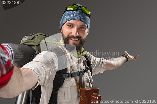 Image of Portrait of a smiling male fully equipped tourist 