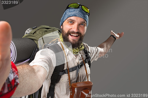 Image of Portrait of a smiling male fully equipped tourist 