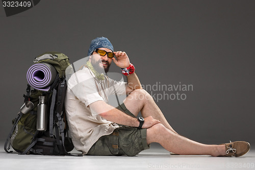 Image of Portrait of a smiling male fully equipped tourist 