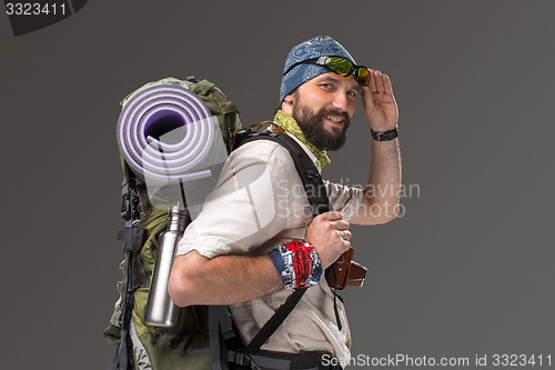 Image of Portrait of a smiling male fully equipped tourist 