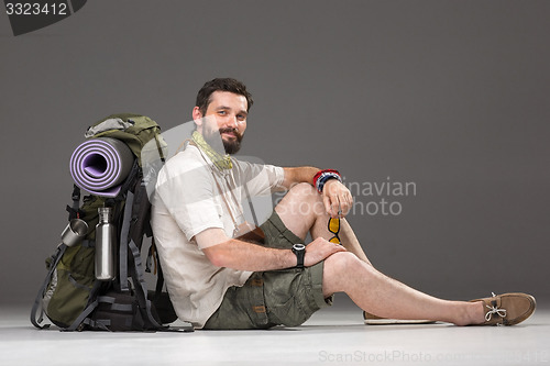 Image of Portrait of a smiling male fully equipped tourist 