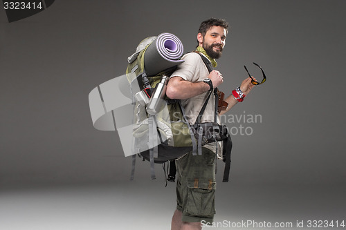 Image of Portrait of a smiling male fully equipped tourist 