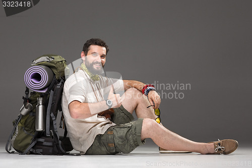 Image of Portrait of a smiling male fully equipped tourist 