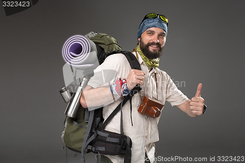 Image of Portrait of a smiling male fully equipped tourist 