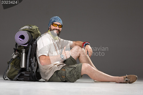 Image of Portrait of a smiling male fully equipped tourist 