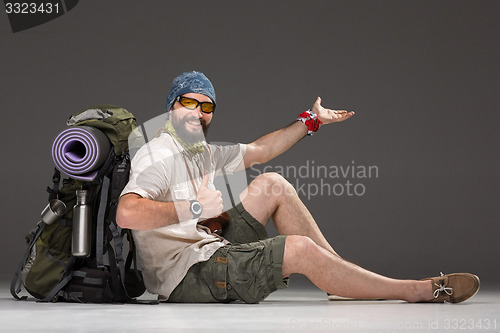 Image of Portrait of a smiling male fully equipped tourist 