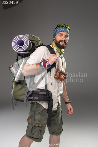 Image of Portrait of a smiling male fully equipped tourist 