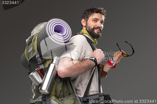 Image of Portrait of a smiling male fully equipped tourist 